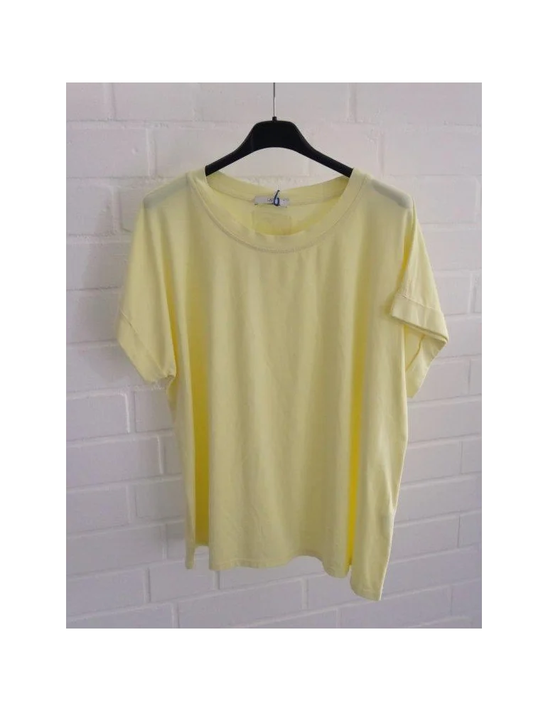 Hellgelbes Damen T-Shirt mit Rundhalsausschnitt auf schwarzem Kleiderbügel