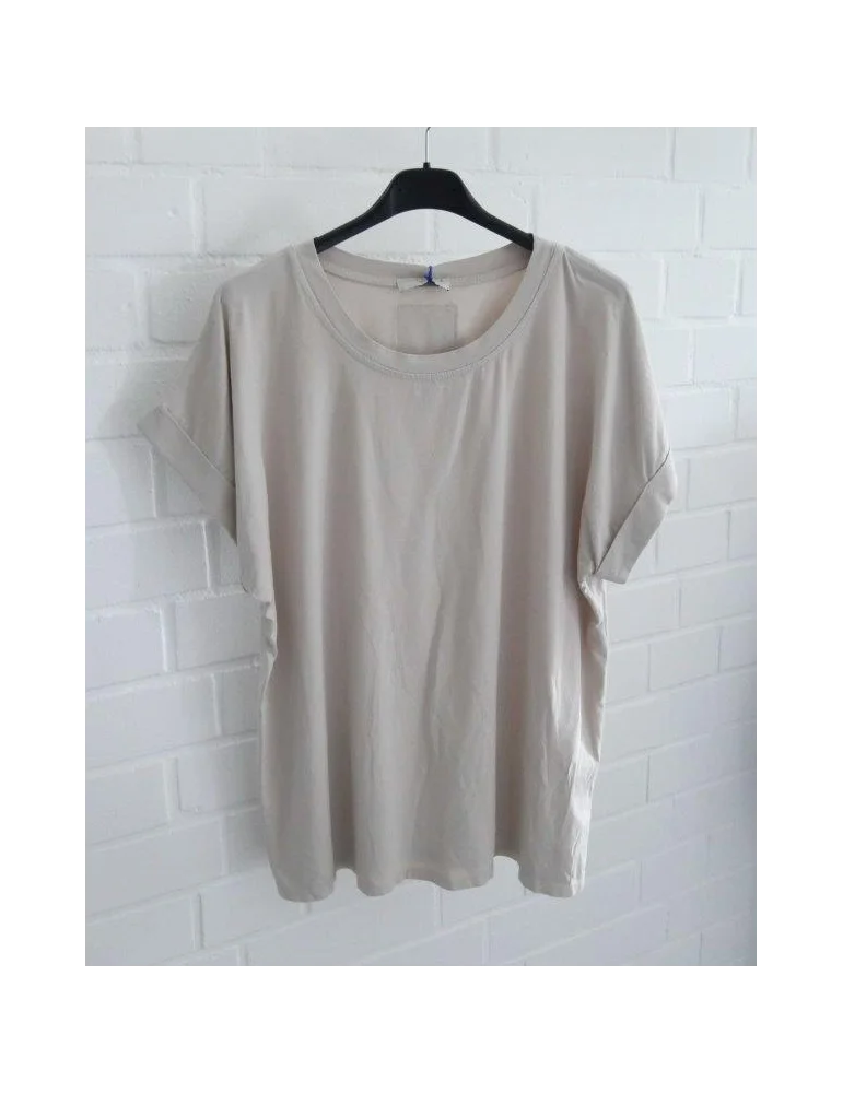 Beiges Damen T-Shirt mit Rundhalsausschnitt auf schwarzem Kleiderbügel