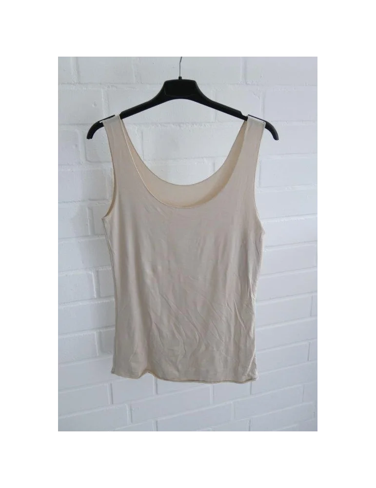 Nahtloses Damen Tanktop in Beige mit Rundhalsausschnitt auf einem Kleiderbügel