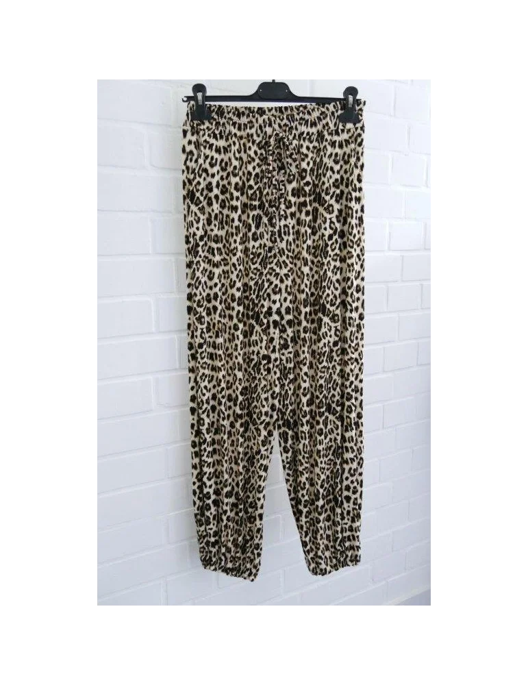 Bequeme Damen-Hose mit Leopardenmuster und Kordelzug auf Kleiderbügel