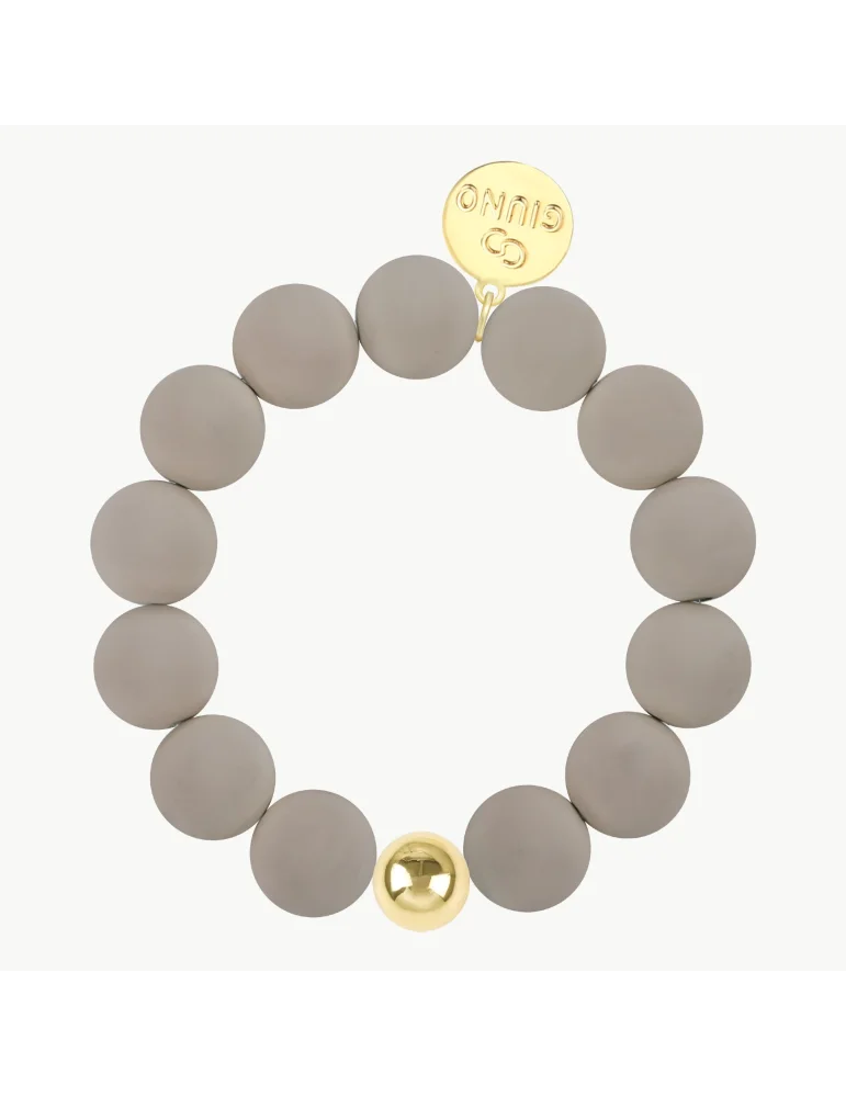 Schlammfarbenes Armband mit matten Perlen und einer goldfarbenen Perle