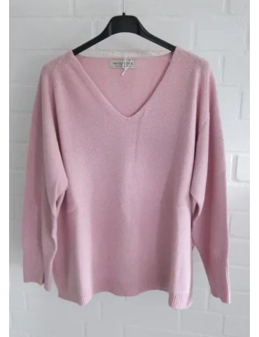 Weicher rosa Feinstrickpullover für Damen mit V-Ausschnitt auf einem schwarzen Kleiderbügel