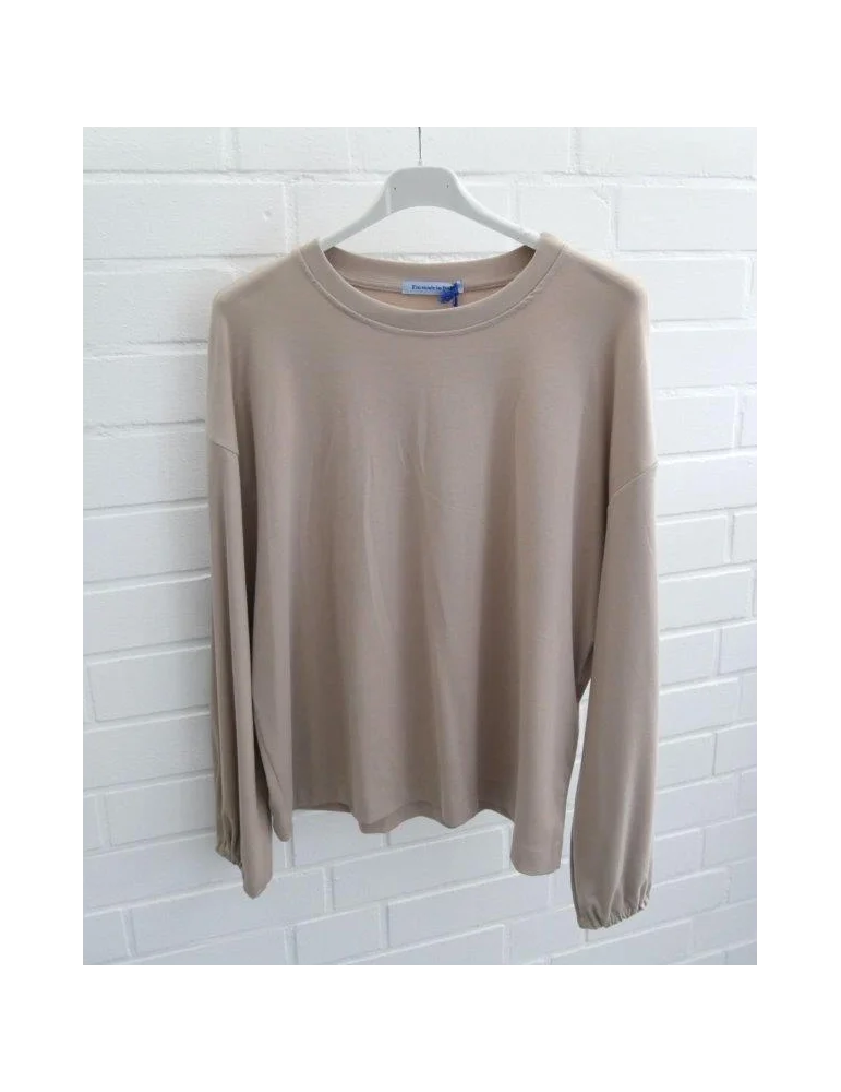 Beigefarbenes Oversize-Longsleeve für Damen mit Ballonärmeln und Bündchen auf Bügel