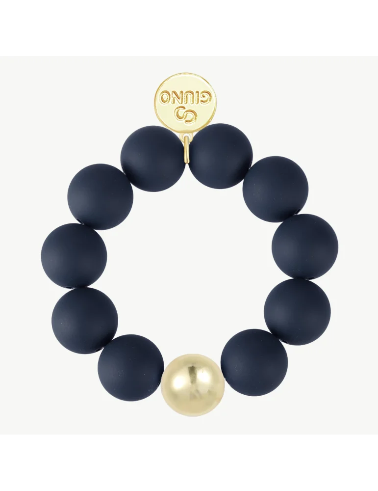 Armband mit dunkelblauen, matten Kugeln und einer goldfarbenen Kugel
