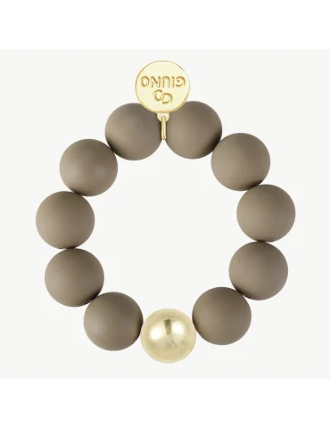 Armband mit schlammfarbenen, matten Kugeln und einer goldfarbenen Kugel
