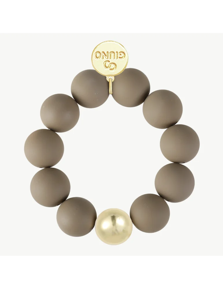 Armband mit schlammfarbenen, matten Kugeln und einer goldfarbenen Kugel