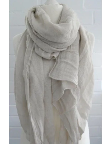 Beiger unisex Schal in Leinenoptik vor weißer Wand