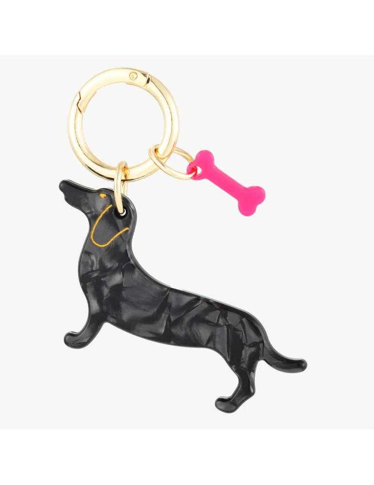 Schlüsselanhänger schwarzer Dackel mit kleinem Knochen extra in pink an einem goldfarbenen Ring