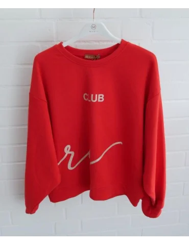 Rotes Oversize Sweatshirt für Damen mit weißem Print vorne und hinten am Bügel