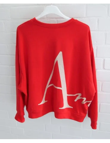 Rotes Oversize Sweatshirt für Damen mit weißem Print vorne und hinten am Bügel von hinten